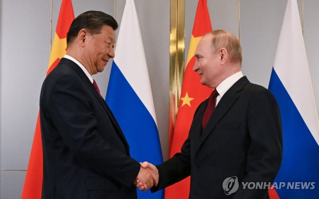 악수하는 시진핑 주석과 푸틴 대통령
[크렘린궁 풀. EPA=연합뉴스 자료사진]