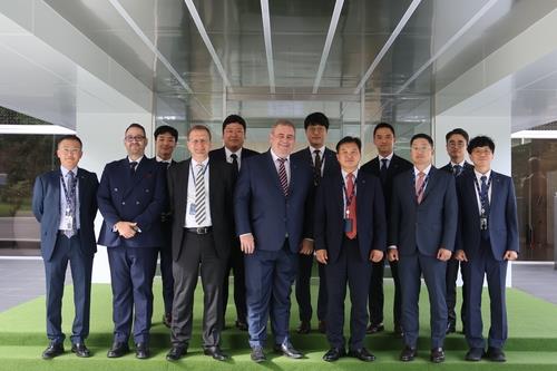 Officials of LIG Nex1 Co. and Airbus DS Germany pose for a photo at a teaming agreement signing cere