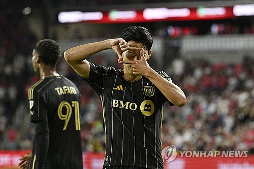 Son Heung-min of Los Angeles Football Club (R) celebrates after scoring a goal against St. Louis Cit
