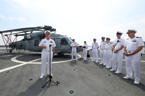 This photo, provided by Kookbangilbo, shows Captain Louis Catalina, commanding officer of the USS Bl