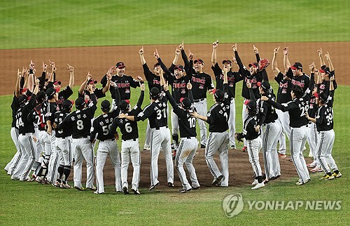 LG Twins players celebrate winning the Korean Series title over the Hanwha Eagles following their 4-