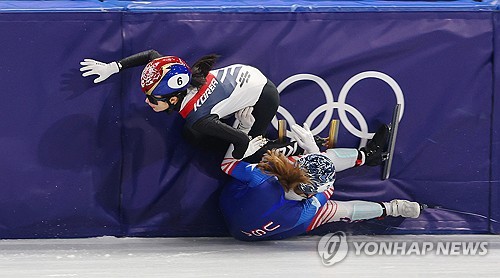 Kim Gil-li of South Korea (top) is tripped up by Corinne Stoddard of the United States during the se
