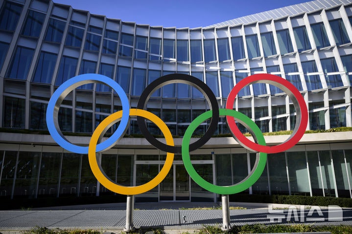 FILE -Olympic Rings are pictured in front of The Olympic House, headquarters of the International Olympic Committee (IOC
