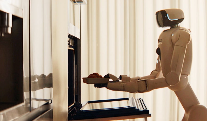 LG 클로이드가 크루아상을 오븐에 넣으며 식사를 준비하고 있다.사진=LG전자 제공