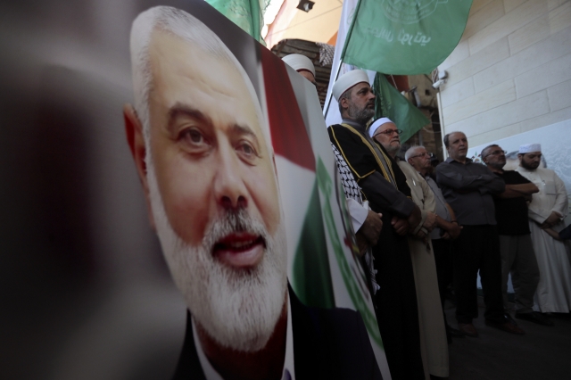 Mourners commemorating Hamas representative Haniyeh. [AP]