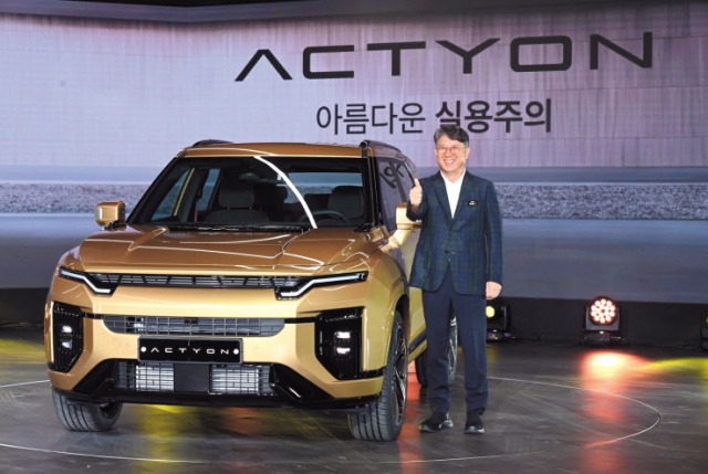 KGM Chairman Kwak Jae-sun poses next to Aktian at the 'Transformation Day' held at KGM headquarters in Pyeongtaek, Gyeonggi Province on the 20th. [KGM provided]