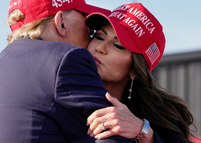 Christie Noem, Governor of South Dakota (right), embracing Donald Trump, former president, during a campaign in Ohio last March. /AP