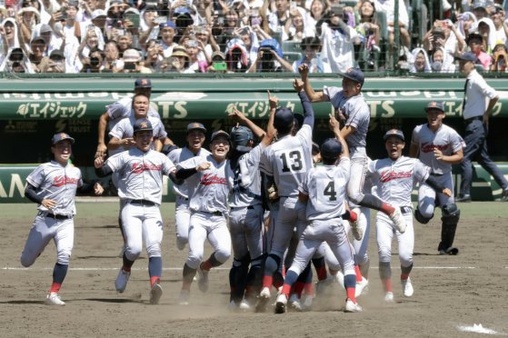 Kyoto International School players celebrating after securing the championship in the summer high school baseball tournament in Japan on the 23rd. Credit: Yonhap News
