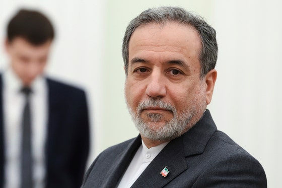 Iranian Foreign Minister Abbas Araghchi stands waiting to meet Russian President Vladimir Putin for the talks at the Kre