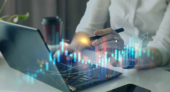 Business person pointing growing virtual hologram of statistics, graph and chart.Business strategy development and growi