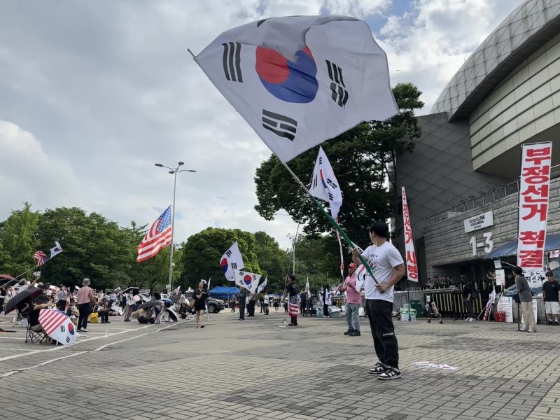 With no end in sight, election protests enter second month
