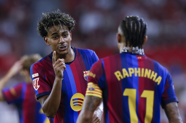 epa13250886 Barcelona's Raphinha (R) celebrates with teammate Lamine Yamal (L) after scoring the 1-3 goal during the Spanish LaLiga soccer match between Sevilla FC and FC Barcelona, in Seville, Spain, 19 September 2026. EPA/JULIO MUNOZ