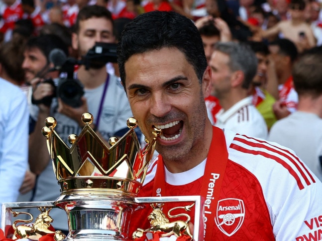 FILE PHOTO: Soccer Football - Premier League - Crystal Palace v Arsenal - Selhurst Park, London, Britain - May 24, 2026 Arsenal manager Mikel Arteta celebrates with the trophy after winning the Premier League Action Images via Reuters/Matthew Childs EDITORIAL USE ONLY. NO USE WITH UNAUTHORIZED AUDIO