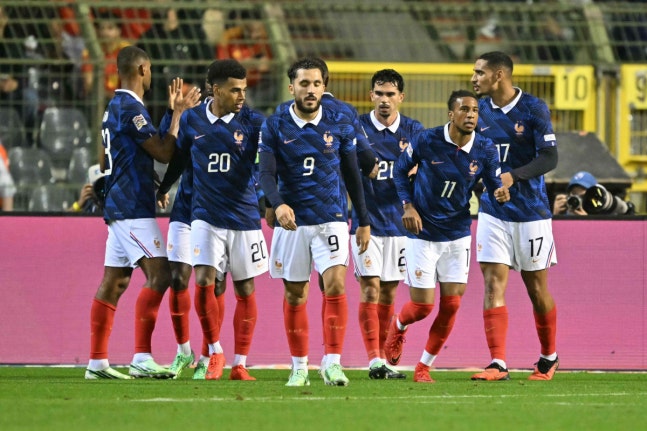France's midfielder #11 Michael Olise (2ndR) is congratulated by teammates after scoring the opening goal during the UEFA Nations League Group A1 football match between Belgium and France at King Baudouin Stadium in Brussels on September 28, 2026. (Photo by NICOLAS TUCAT / AFP)