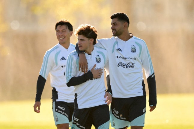 Argentina's forward Julian Alvarez (C), defender Cristian Romero (R) and defender Lisandro Martinez attend a football training session at the Argentine Football Association (AFA) training camp in Ezeiza, Buenos Aires Province, on October 5, 2026, ahead of the friendly match against Benin. (Photo by