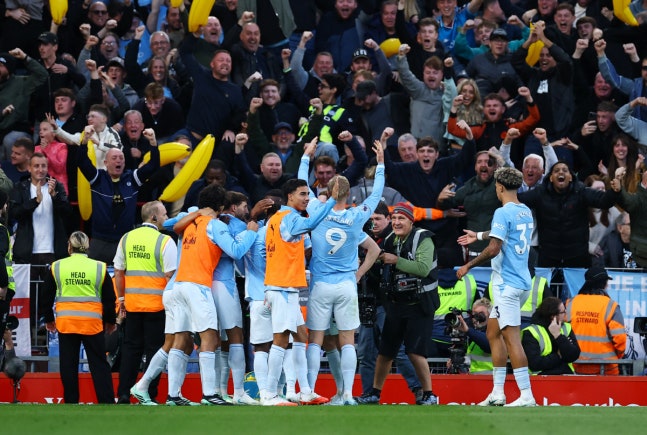 Soccer Football - Premier League - Liverpool v Manchester City - Anfield, Liverpool, Britain - October 11, 2026 Manchester City's Erling Haaland celebrates scoring their first goal with teammates REUTERS/Phil Noble EDITORIAL USE ONLY. NO USE WITH UNAUTHORIZED AUDIO, VIDEO, DATA, FIXTURE LISTS, CLUB/