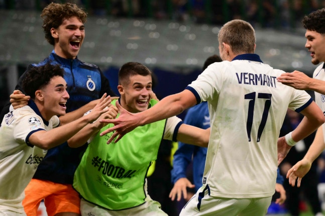 Club Brugge's Belgian forward #17 Romeo Vermant celebrates scoring his team's fourth goal with teammate Club Brugge's German forward #07 Nicolo Tresoldi during the UEFA Champions League first round day 2 football match between Inter Milan and Club Brugge at San Siro stadium in Milan, on October 13, 