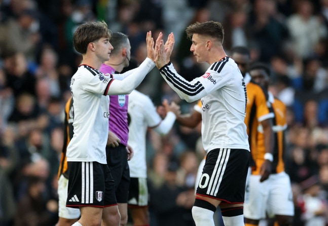 Soccer Football - Premier League - Fulham v Hull City - Craven Cottage, London, Britain - October 17, 2026 Fulham's Cesar Palacios celebrates with Tom Cairney after the match Action Images via Reuters/Paul Childs EDITORIAL USE ONLY. NO USE WITH UNAUTHORIZED AUDIO, VIDEO, DATA, FIXTURE LISTS, CLUB/LE