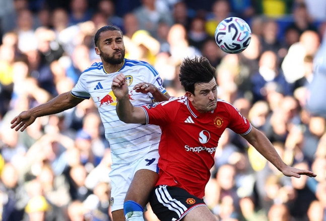 Soccer Football - Premier League - Leeds United v Manchester United - Elland Road, Leeds, Britain - October 18, 2026 Manchester United's Harry Maguire in action with Leeds United's Dominic Calvert-Lewin REUTERS/Phil Noble EDITORIAL USE ONLY. NO USE WITH UNAUTHORIZED AUDIO, VIDEO, DATA, FIXTURE LISTS