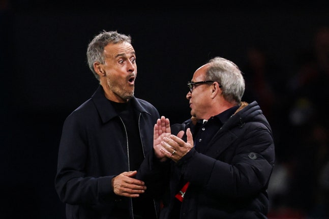 PSG's Spanish headcoach Luis Enrique and Paris Saint Germain's Portuguese Football Advisor Luis Campos react at the end of the UEFA Champions League first round day 3 football match between Paris Saint-Germain (PSG) and FC Barcelona at the Parc de Princes stadium in Paris on October 20, 2026. (Photo