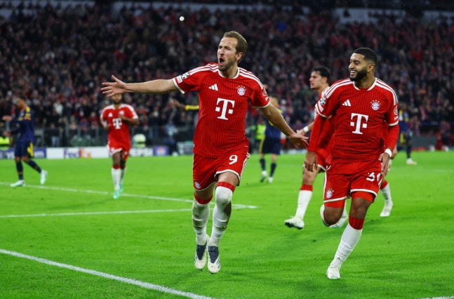 Soccer Football - UEFA Champions League - Bayern Munich v Arsenal - Allianz Arena, Munich, Germany - October 21, 2026 Bayern Munich's Harry Kane celebrates scoring their second goal with Ismael Saibari REUTERS/Kai Pfaffenbach