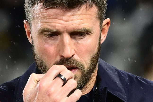 Manchester United's English coach Michael Carrick reacts prior to the UEFA Champions League, league phase matchday 3, football match between Como 1907 and Manchester United at the Stadio Giuseppe Sinigaglia in Como, northen Italy on October 21, 2026. (Photo by PIERO CRUCIATTI / AFP)