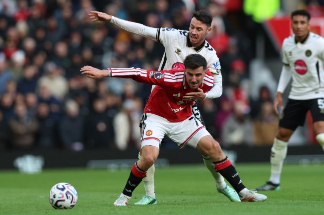 Manchester United's English midfielder #07 Mason Mount vies with Bournemouth's English defender #15 Adam Smith during the English Premier League football match between Manchester United and Bournemouth at Old Trafford in Manchester, north west England, on October 25, 2026. (Photo by Darren Staples /