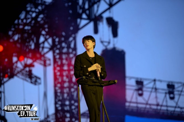 Jin's concert performance showcasing stage presence