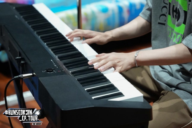 Jin connecting with fans during concert performance