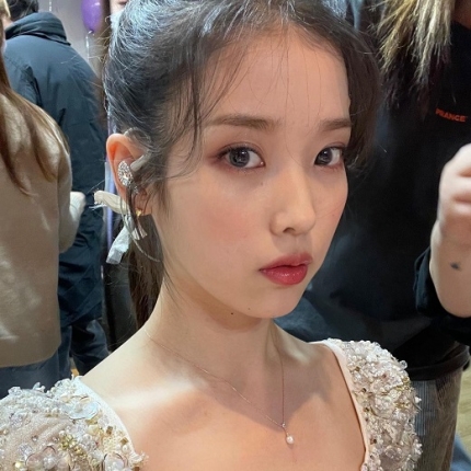 photos of IU during the grand opening with the song 'Lilac'