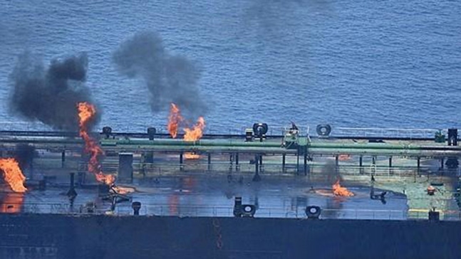 Flames and smoke soaring from the burning ship, the Sunion [provided by the Aspides Operation Headquarters]