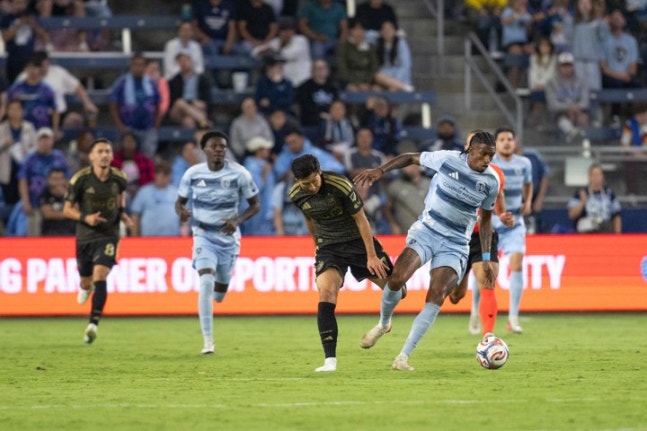 Sep 12, 2026; Kansas City, Kansas, USA; Los Angeles FC forward Son Heung-Min (7) and Sporting Kansas City midfielder Andre Luiz (11) compete for a ball during the second half at Children's Mercy Park. Mandatory Credit: Kylie Graham-Imagn Images