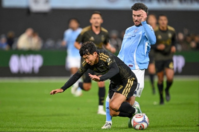 Oct 17, 2026; New York, New York, USA; Los Angeles FC forward Son Heung-Min (7) is fouled by New York City FC defender Aiden O'Neill (21) during the first half at Citi Field. Mandatory Credit: Mark Smith-Imagn Images