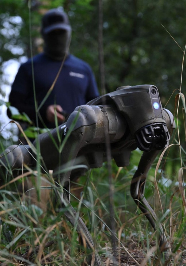 Ukrainian military unveils robot dogs prepared for deployment on the battlefield. [Image source=AFP News]