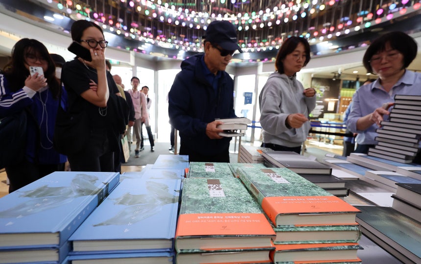 Citizens visiting Kyobo Bookstore in Jongno-gu, Seoul on the 11th are purchasing books by author Han Kang, who won the Nobel Prize in Literature. / News1