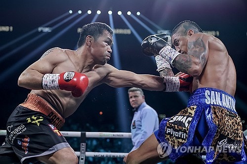 '<b>복싱 영웅</b>' <b>파퀴아오</b>, 17살 어린 챔피언과 대결서 무승부