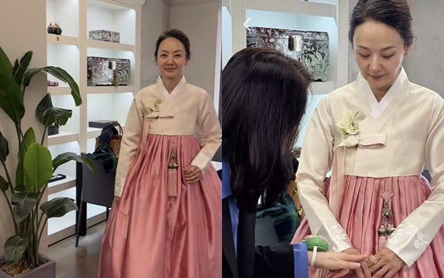 ピンク色のスカートと白いチョゴリの婚礼韓服を着たペ・ジョンオク