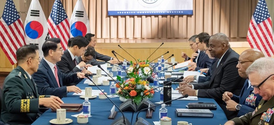 Then-Defense Minister Kim Yong-hyun, second from left, meets with former U.S. Defense Secretary Lloy