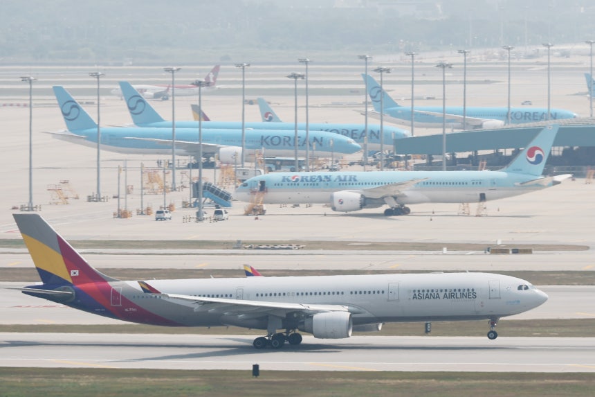 Aircrafts are seen parked on the tarmac at Incheon International Airport on June 16. YONHAP