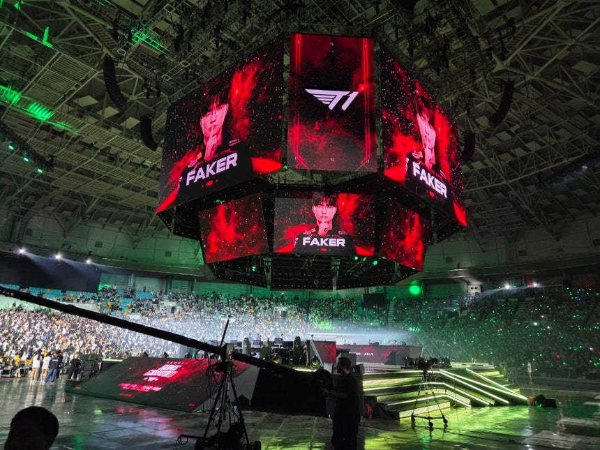 Fans cheer for Faker during at T1's Home Ground event on the League of Legends Champions Korea road show in KSPO Dome in
