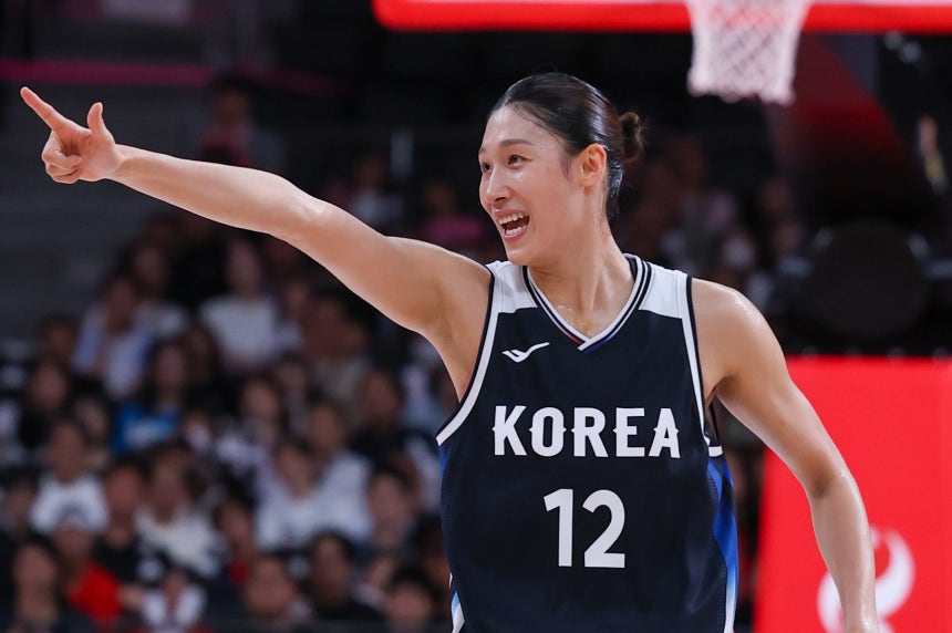 Forward Lee Hae-ran celebrates after making a 3-pointer against Japan in the Asian Games women's basketball final at Aic