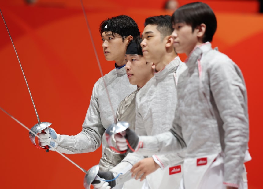 Oh Sang-uk, Park Sang-won, Do Gyeong-dong and Hwang Hee-geun walk out for the men's team sabre semifinal against Hong Ko