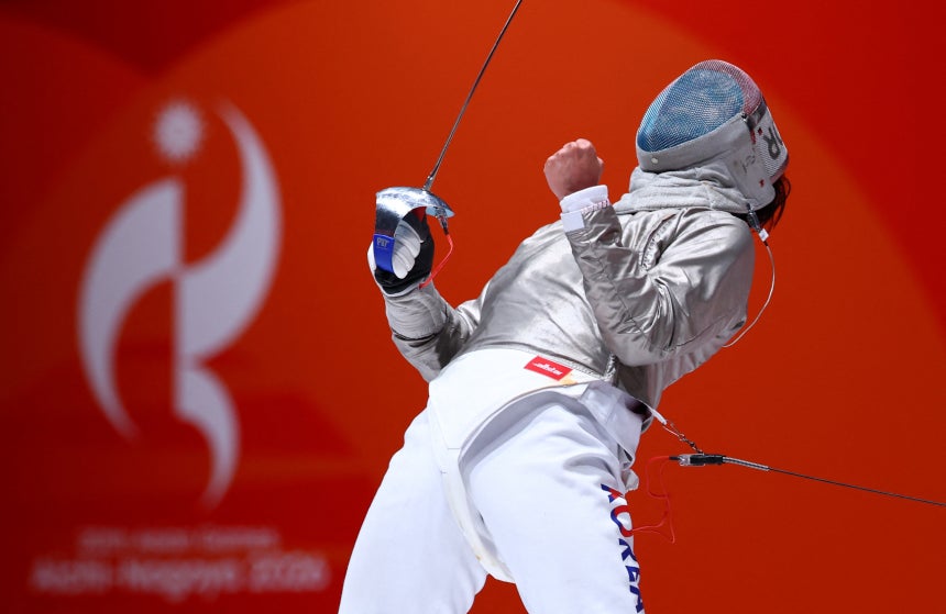 Park Sang-won reacts during his bout against Japan's Kento Yoshida in the men's team sabre final at the Asian Games at A
